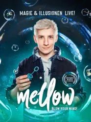 Ein junger Mann präsentiert ein Zaubertrick-Set mit Seifenblasen. Der Hintergrund zeigt eine mystische Atmosphäre mit Blasen und leuchtenden Effekten.