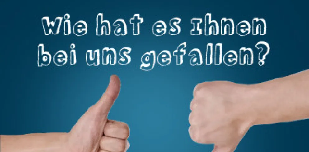 Zwei Daumen, einer zeigt nach oben, der andere nach unten